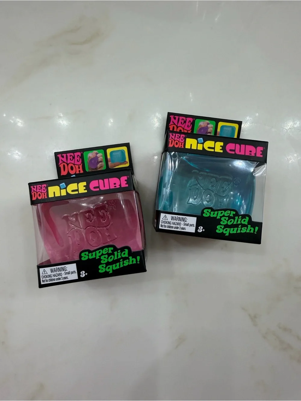 NeeDoh Nice Cube Super Solid Squish Toy - 2 Pack Bundle. Blue, Pink